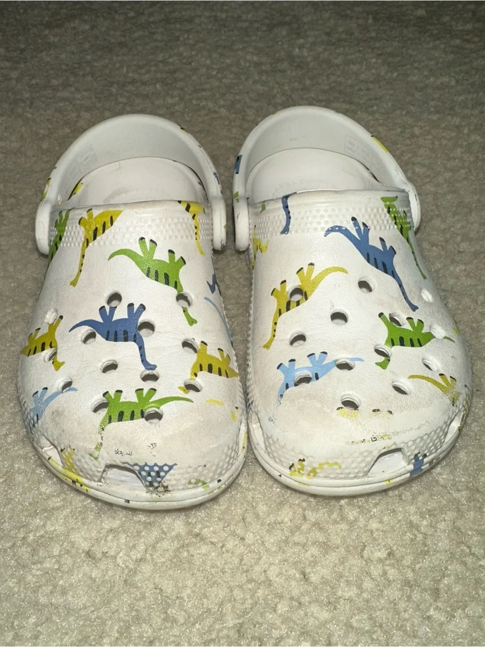 CROCS White Kids Clogs with Blue, Green & Yellow Dino Pattern